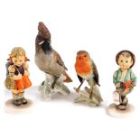 Two Hummel figures, modelled as school girl and globe trotter, together with two Goebel figures of a