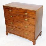 A George III mahogany chest, of two short over three long graduated drawers, raised on bracket feet,