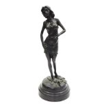 A bronze figure of lady, modelled standing, on a circular socle, signed F. Rude, 32cm high.