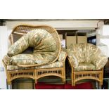 A conservatory suite, comprising two seater sofa and two armchairs, with elephant patterned upholste