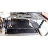 A glass three tier television stand, 51cm high, 100cm wide, 46cm deep.