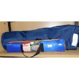 A two man tent, an awning and tent pole storage bag.