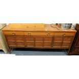 A mid 20thC oak sideboard, the top with three drawers above three panelled doors, 84cm high, 180cm w