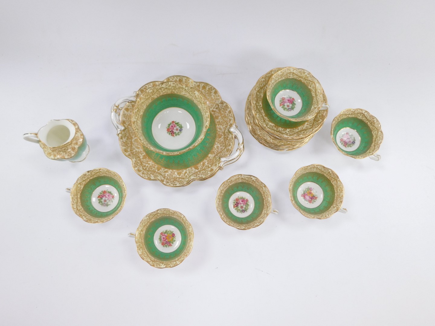 A George Jones and Sons crescent china part tea service, on a green and gilt design with cream - Image 2 of 3