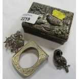 A silver and marcasite basket brooch, an owl brooch and a miniature pewter frame. (3)