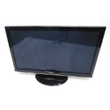 A Panasonic Viera TX-52 inch colour flat screen television, in black trim with remote controls and i