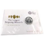 A Royal Mint Treasure For Life Longest Reigning Monarch twenty pound fine silver coin, with outer pa