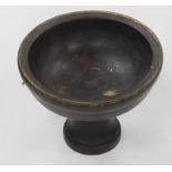 A treen font shaped bowl, with metal banding, on shaped stem and circular foot, 25cm high, 32cm diam