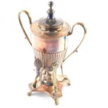 A late 19thC samovar, with front tap, and part fluted body, with shell handle and burner beneath on