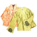 A highly decorative ladies quarter length Japanese silk jacket, in red, decorated with butterflies a