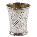 A Queen Anne silver beaker, probably John Conaty, the tapering body repousse decorated with flowers,