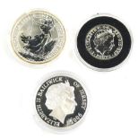 An Elizabeth II two pound 1oz fine silver proof coin, a Guy Penrose Gibson five pound proof, and a o