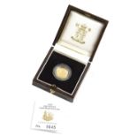 A Britannia one tenth ounce proof gold ten pound coin, boxed with paperwork.