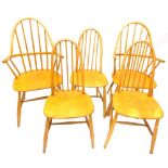 A set of four Ercol style beech and satin birch kitchen chairs, two with arms, each stamped WW.