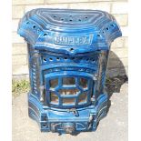 A Simplex cast iron stove, in serpentine blue casing, partially pierced with front knops, 68cm high.
