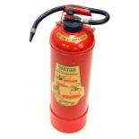 A vintage Minimax fire extinguisher, in red with black trim, 69cm high.