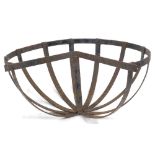 A wrought iron C shaped planter trough hanging, 42cm wide.