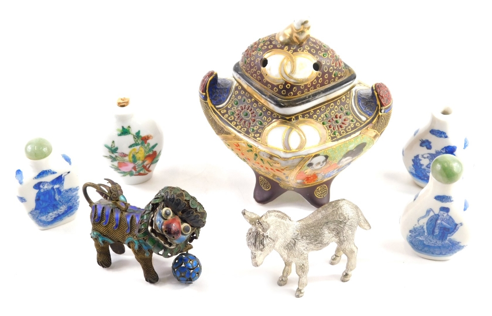 A cloisonne and mesh work articulated Chinese figure of a temple dog, with front foot on orb, decora