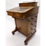 A Victorian walnut boxwood strung and marquetry Davenport, the raised top with a brass rail above a