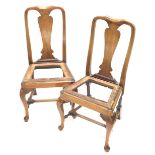 A pair of Queen Anne style walnut dining chairs, with hour glass splats and front turned supports on