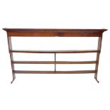 An 18thC oak plate rack, with a moulded cornice above three shelves, 217cm wide, 122cm high.