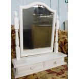 A table mirror in white, with turned supports, plain serpentine glass and two drawers, 58cm high.