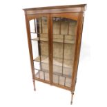 An Edwardian mahogany and satinwood crossbanded display cabinet, with a moulded cornice above two as