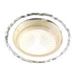 A George VI silver dish, by Walker and Hall, with piecrust outline and star cut glass insert, Sheffi