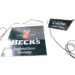 A Beck's Imported from Germany beer glass sign, 56cm x 59cm, and a Carling Extra Cold advertising si