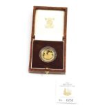 A Britannia 22ct gold quarter ounce gold proof twenty-five pound coin 1997, boxed with paperwork.
