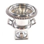 An Edward VII silver campana vase, with fully gadrooned top by Thomas Bradbury, on a square base, Sh