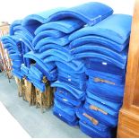 A collection of 1920/30's gilt painted metal and blue upholstered cinema seats, some bearing numbers