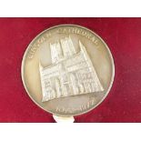 A Lincoln Cathedral 1072-1972 commemorative silver medallion, 6cm diameter, in fitted case.