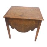 A late 18thC/early 19thC oak box commode, the hinged lid with a ceramic insert above a shaped apron,