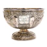 A 19thC electroplated Britannia metal punch bowl, repousse decorated with scrolls, leaves, repeat li