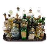 Antique and vintage medicine bottles and oils, including First Aid Embrocation by Verge Brothers, Ja