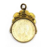 A George IV gilt shilling dated 1829, in a plated swivel pendant mount, 10.9g all in.