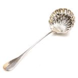 A late 19thC French silver sifter spoon, the handle cast with armorial crest, with a shell shaped pi