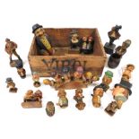 Antique and vintage Black Forest and Swiss carved figures, including nutcrackers and bottle stoppers