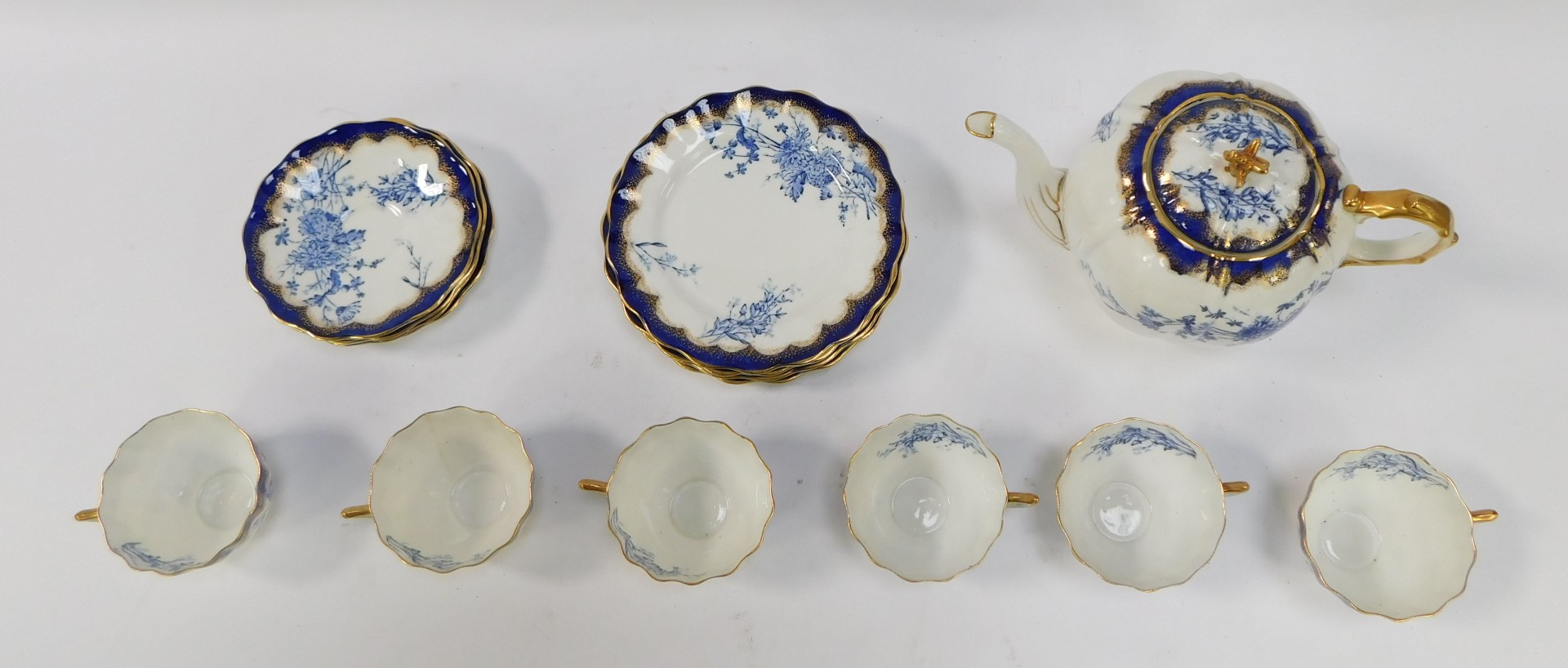 A 20thC blue and white part tea service, comprising teapot, six cups, five saucers, six side plates, - Bild 2 aus 3