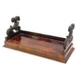 A 19thC mahogany book stand, with two scroll ends and a galleried top, with bead and reel border, 23