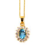 A blue zircon and diamond set cluster pendant, the pendant with central blue zircons surrounded by t