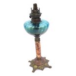 A Victorian glass oil lamp, with a turquoise glass shade on turned marble effect column, with brass