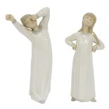 Two Lladro figures, comprising boy yawning and lady reclining, 22cm high. (2)
