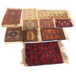 A collection of mats and rugs, each of varying design, 30cm x 30cm, 30cm x 29cm, 36cm x 30cm, 43cm x