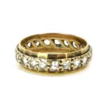 An eternity ring, set with CZ in a hammered outer border, yellow metal stamped 9ct, size P½, 3.6g al