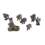 A group of metal and stone carved animals, to include a ram, hippo, Eastern bull, etc. (a quantity)