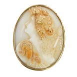 A 19thC shell cameo brooch, with raised maiden in flowing robes and headdress, in a yellow metal fra
