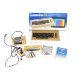 A Commodore 64 computer, controllers and accessories, boxed. (a quantity) WARNING!
