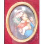 A continental early 20thC portrait miniature, of mother and children, in gilt surround in a fitted c